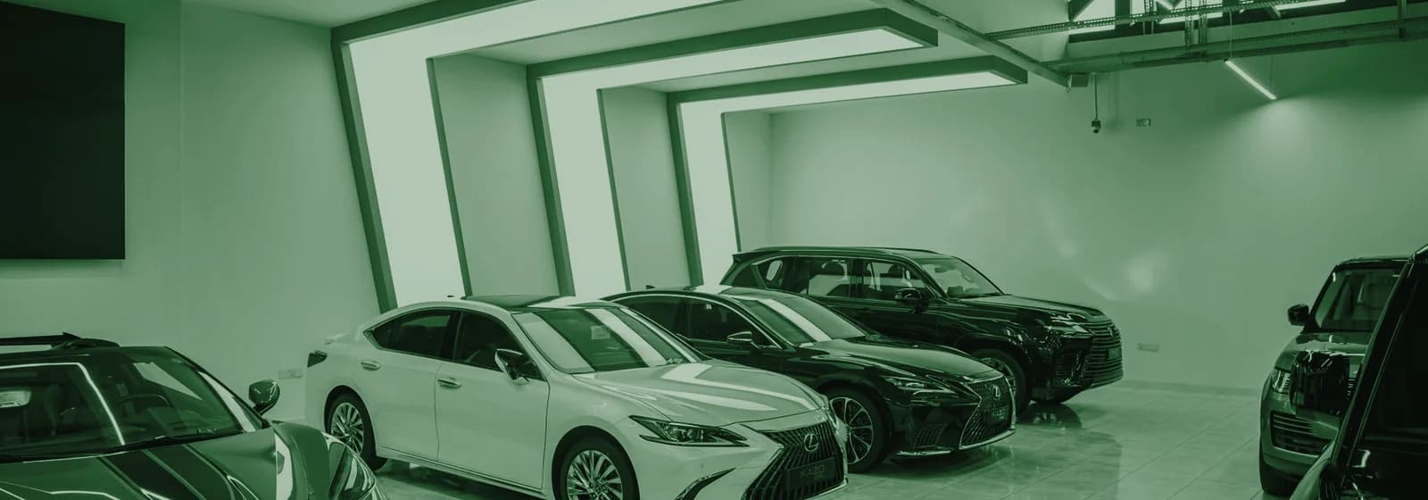 New vehicles lined up on a dealership showroom floor